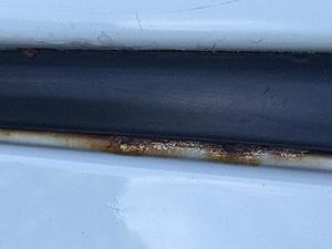 2009 xD Roof Rust under Black Vinyl Roof Strips-img_2577.jpg